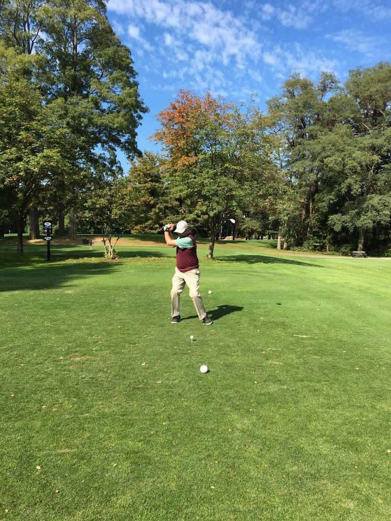 Younus Samadzada at the top of his golf swing